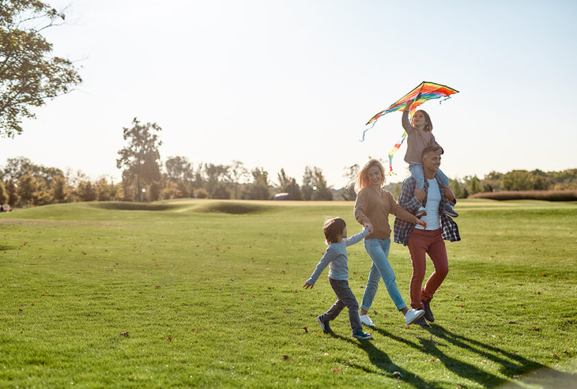 family walking kite